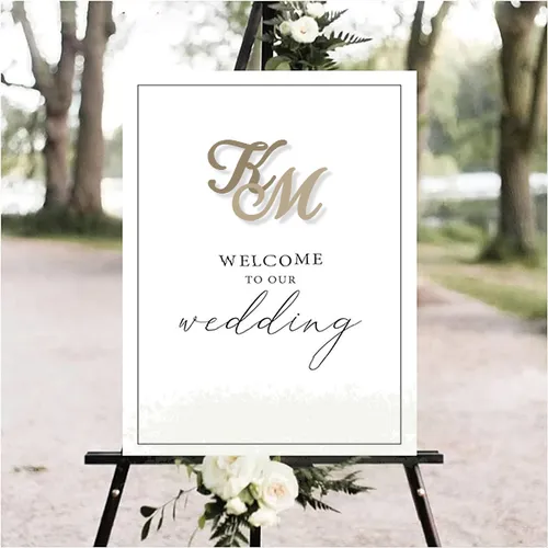Wedding event sign Wedding event sign with flowers, set against a forest background.
