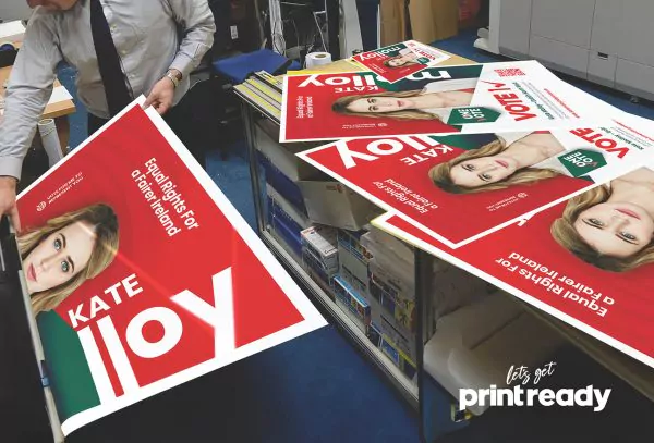 Election posters being checked on the print room floor