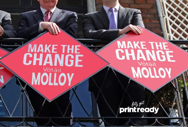 Make the Change campaign signs held at a campaign event