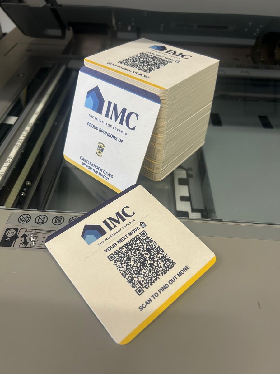 Two printed beermats and a stack, QR side and sponsors side