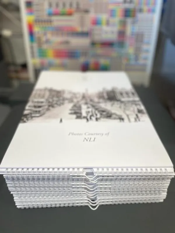 Stack of spiral-bound A3 calendars with heritage photography - Print Ready