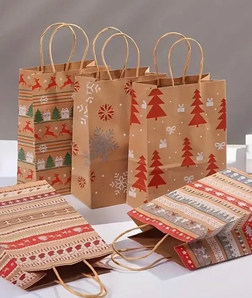 Kraft Christmas gift bags with reindeer and tree designs