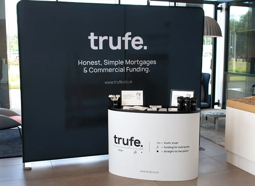 Printed fabric display wall and branded counter installed for trufe, printed by Print Ready