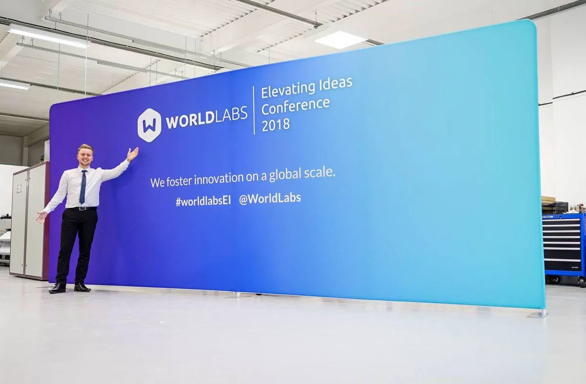 Five metre printed fabric conference wall for WorldLabs checked in the Print Ready workshop
