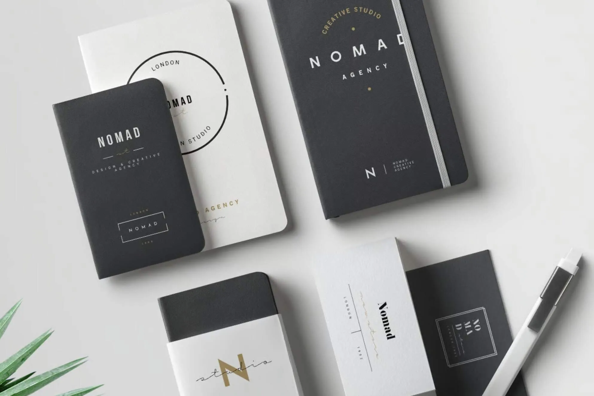 Branded notebooks showing consistent brand colours