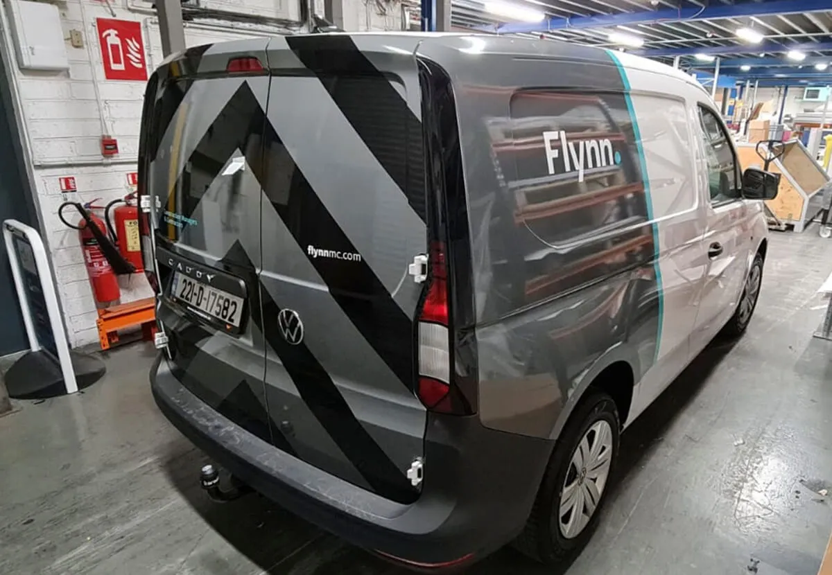 Grey van with Flynn vehicle wrap in the Print Ready workshop