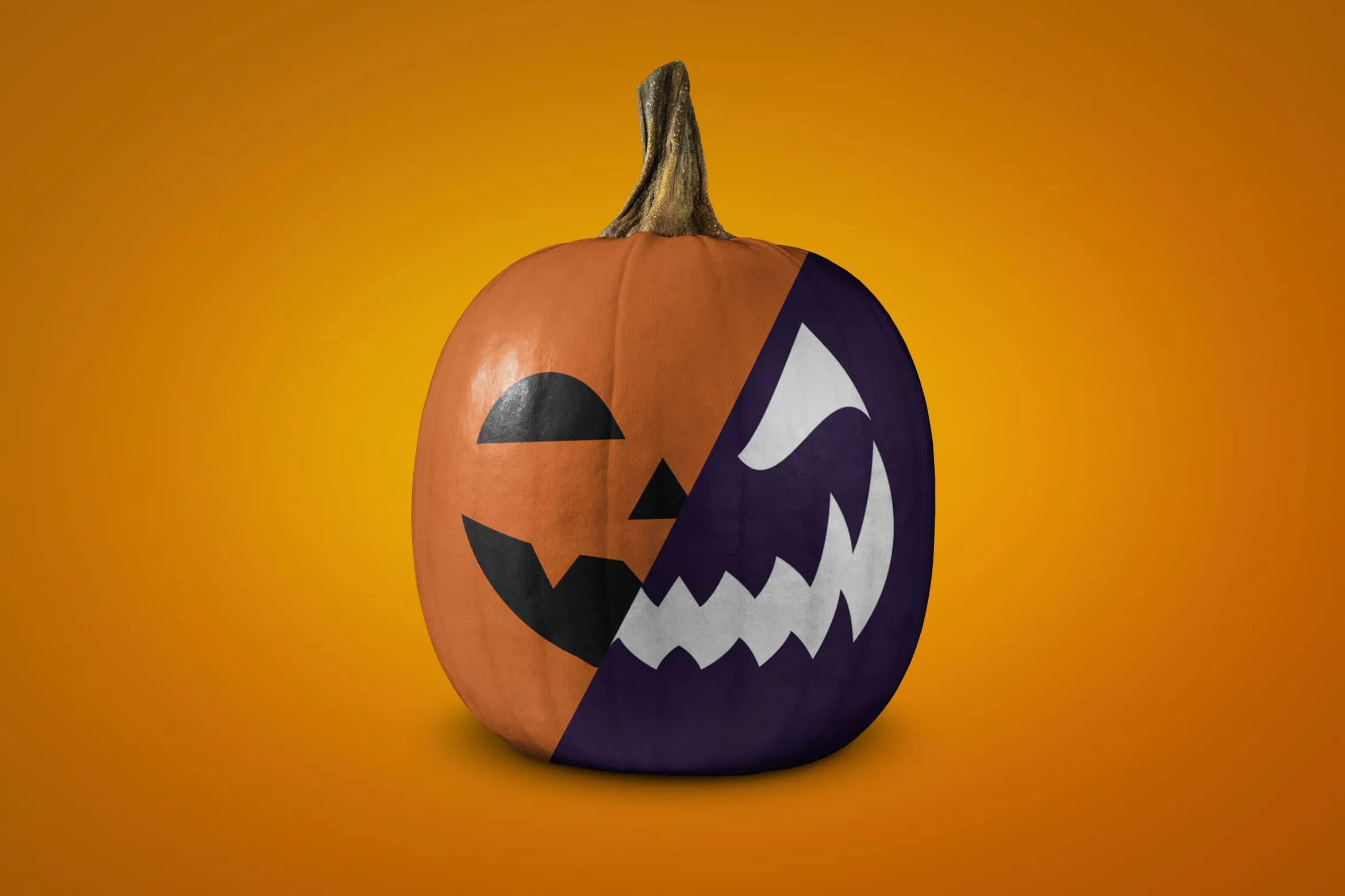 Carved Halloween pumpkin on an orange background