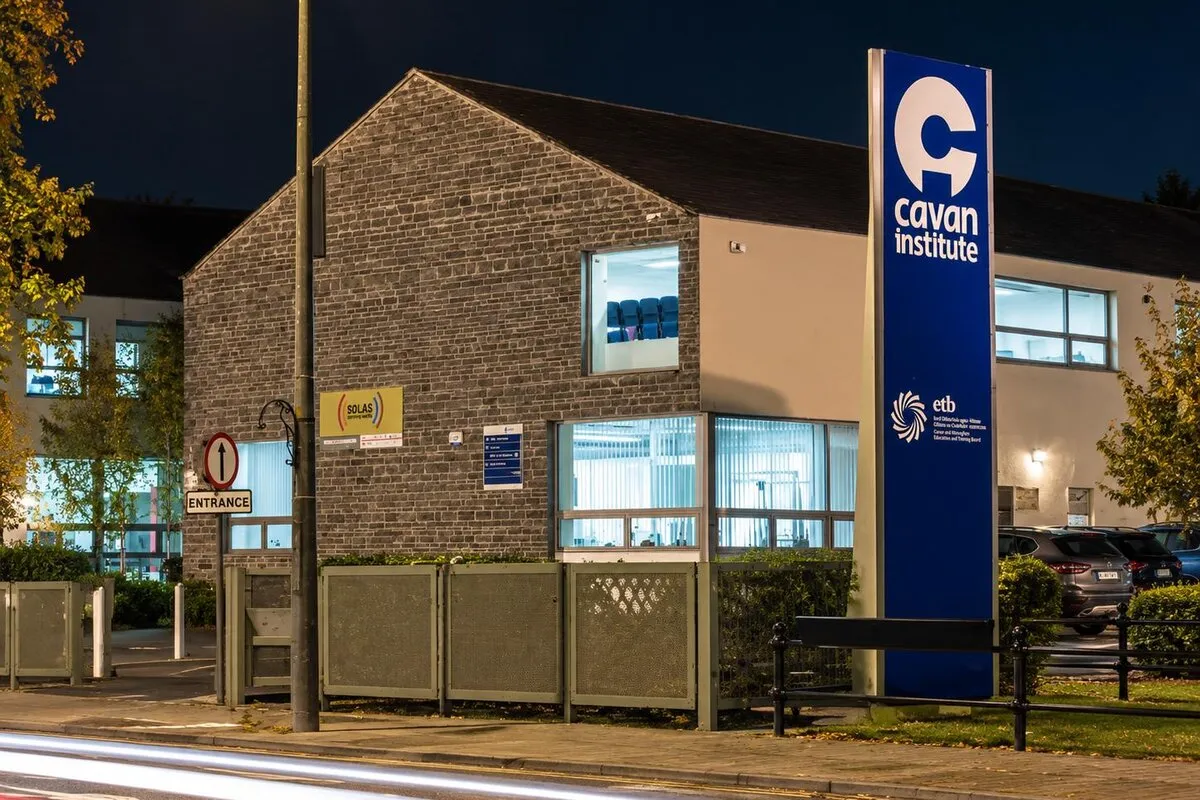 Cavan Institute campus building with the new Cavan Institute totem sign at night