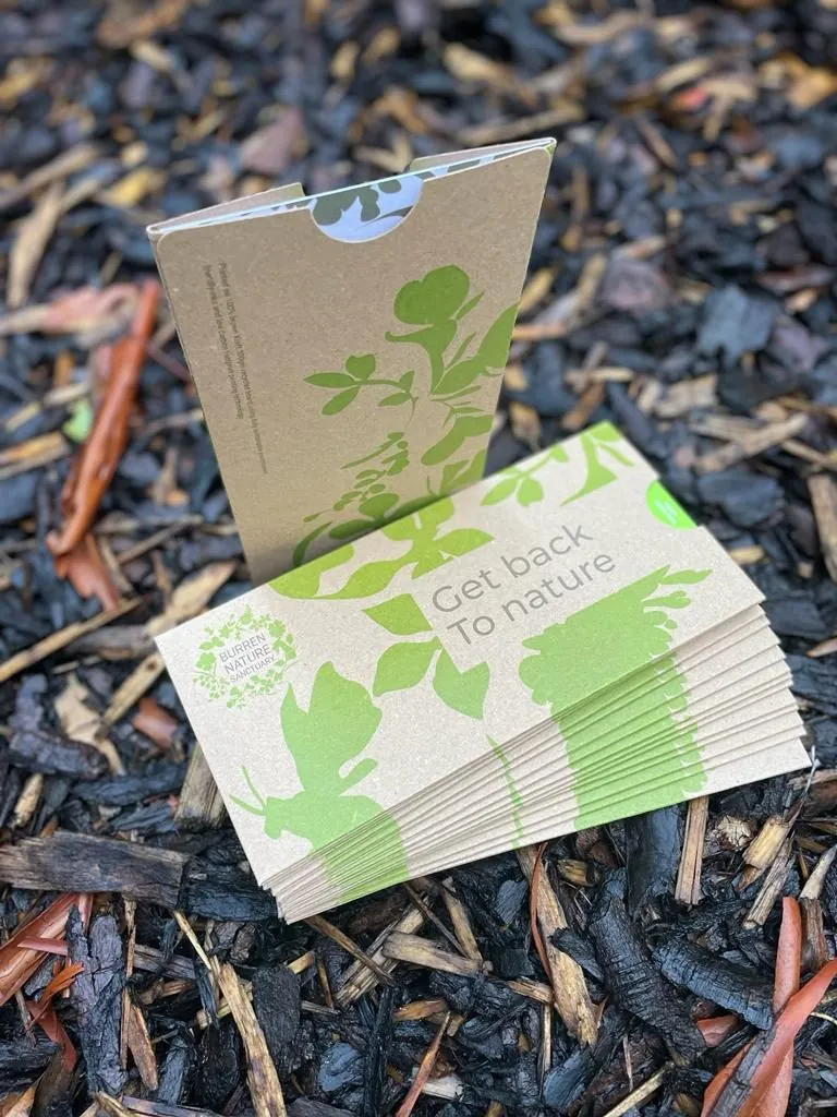 Kraft gift voucher pouches on a log - Print Ready