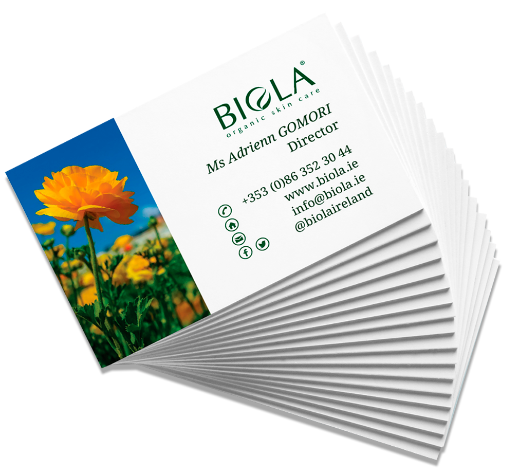 Elegant printed BIGLA business cards fanned beside flowers