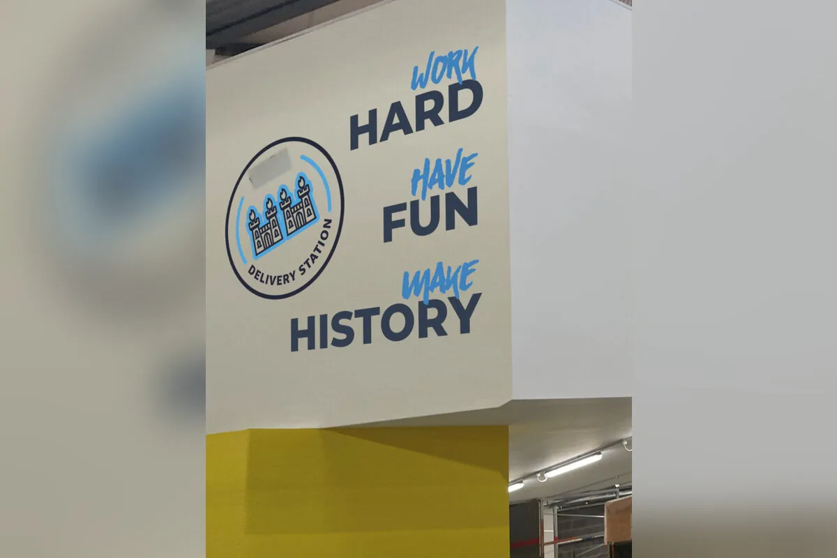 Fulfilment centre wall graphic with work hard, have fun, make history