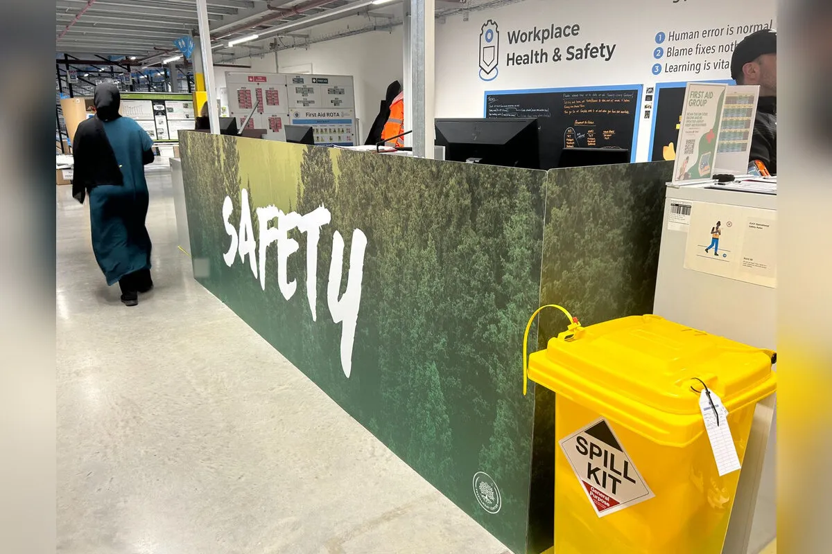 Fulfilment centre safety desk wrapped in forest graphics