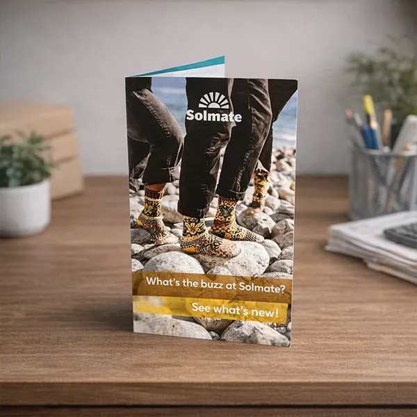 Printed Solmolte flyer standing on a desk showing fine detail and finish