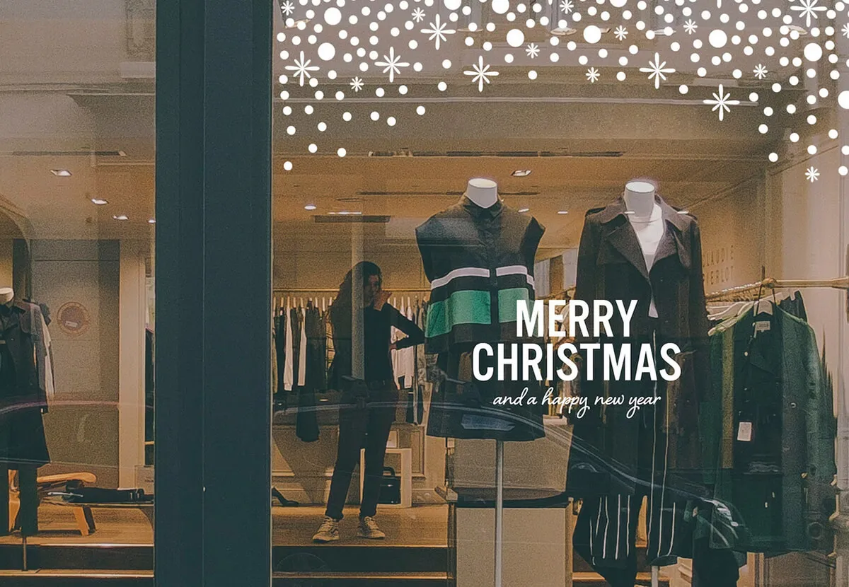 Shop front window with a festive Merry Christmas vinyl decal