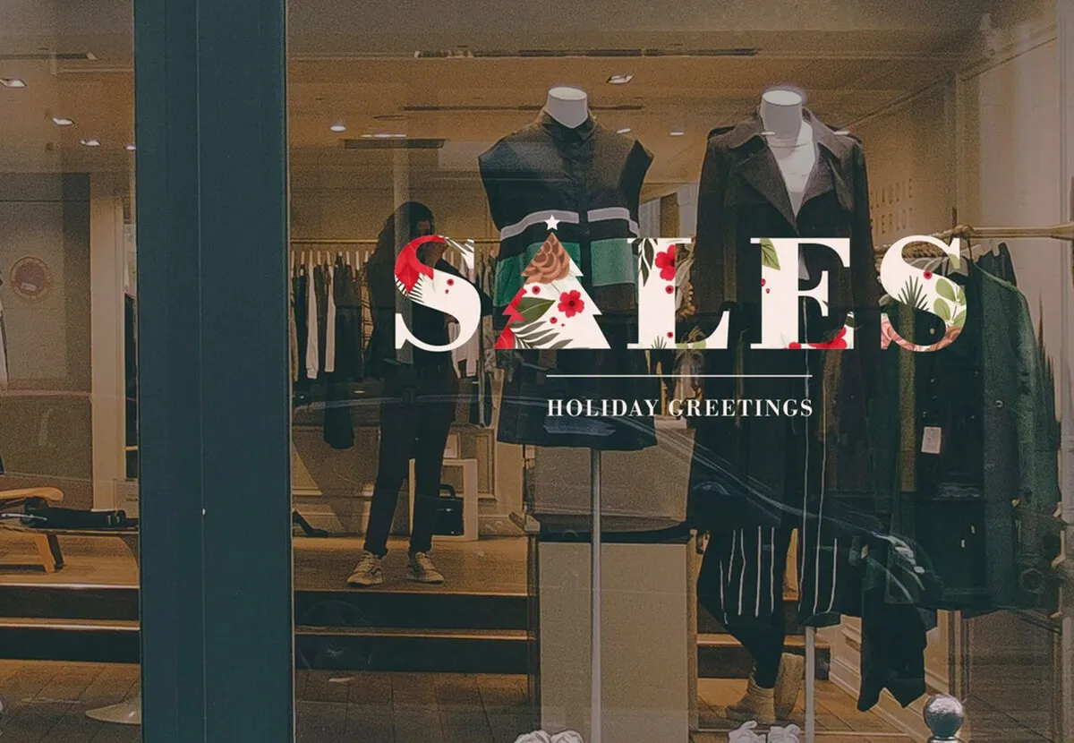 Retail window with SALES holiday vinyl lettering