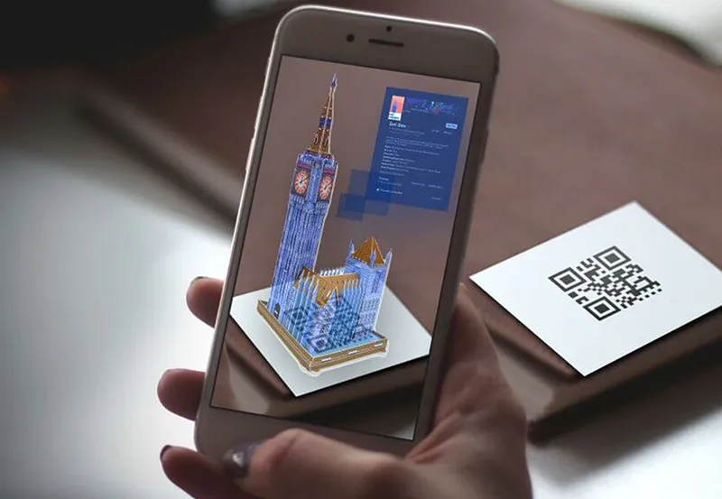 Augmented reality print: phone revealing a 3D landmark from a QR card