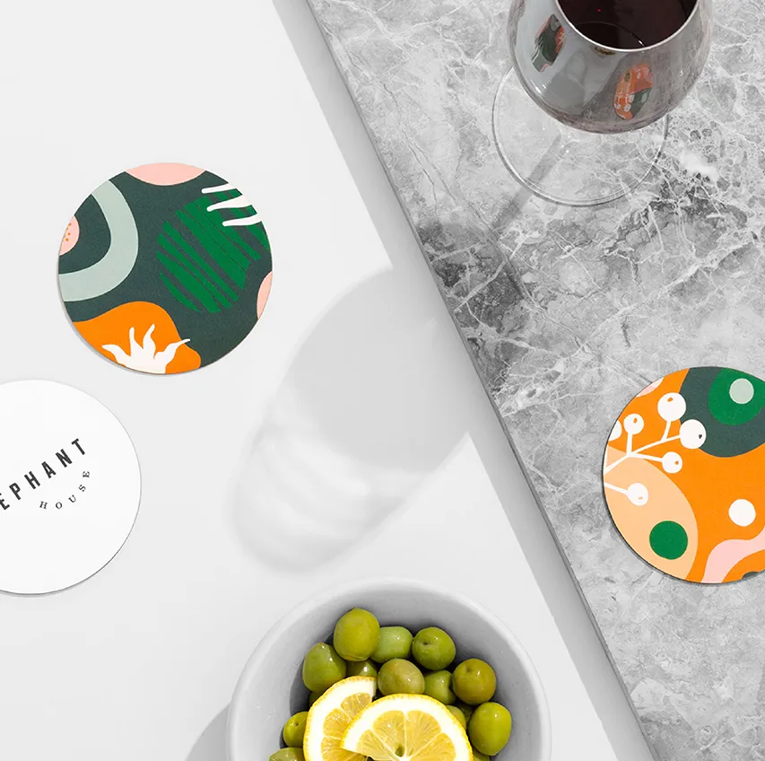 Beermat with drink on marble bar top