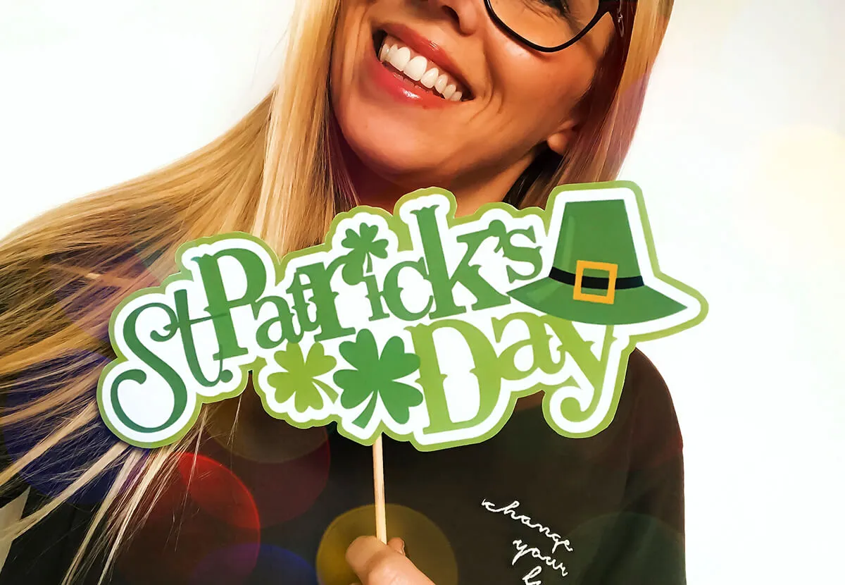 Customer holding a St Patrick’s Day photo booth prop