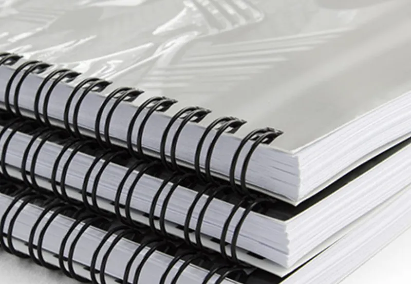 Stack of wire-bound documents from Print Ready