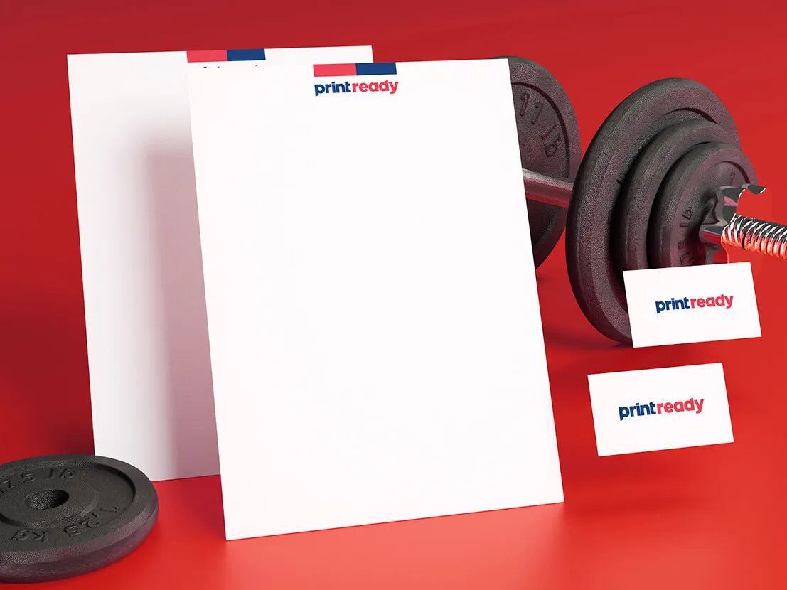 Print Ready paper sheets and business cards beside gym weights, illustrating paper thickness
