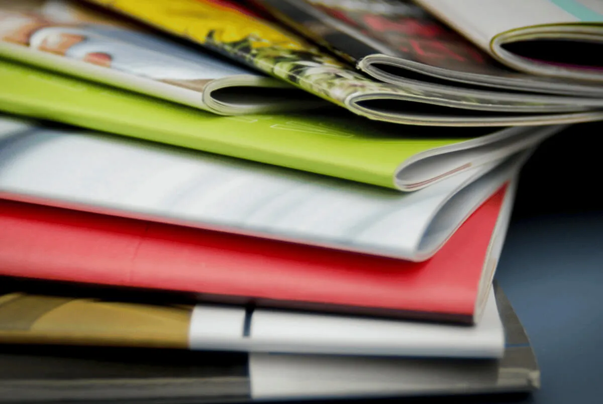 Stack of printed brochures and magazines