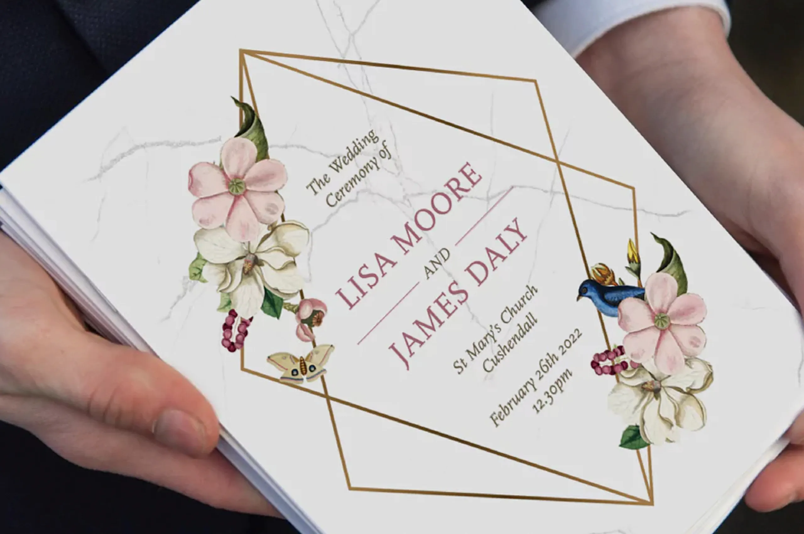 Guest holding a printed wedding mass booklet