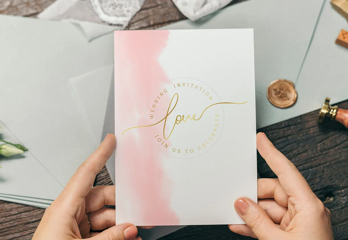 Pink watercolour wedding invitation with gold foil script