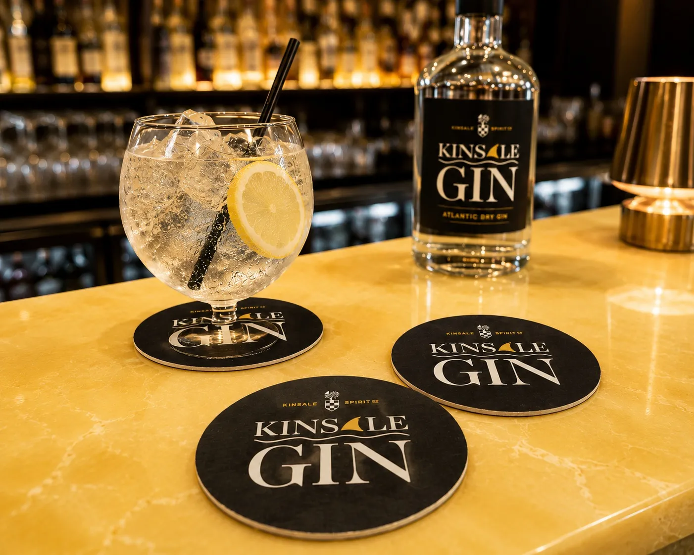 Kinsale Gin round beermats on a bar with a gin and tonic, printed by Print Ready