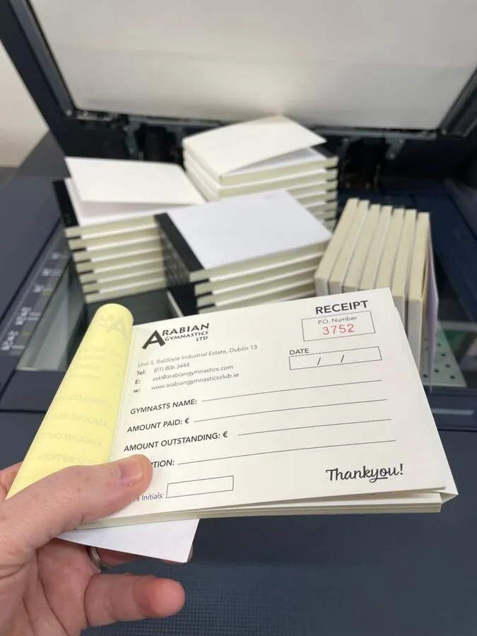 A6 carbon copy receipt books for a gymnastics club - Print Ready