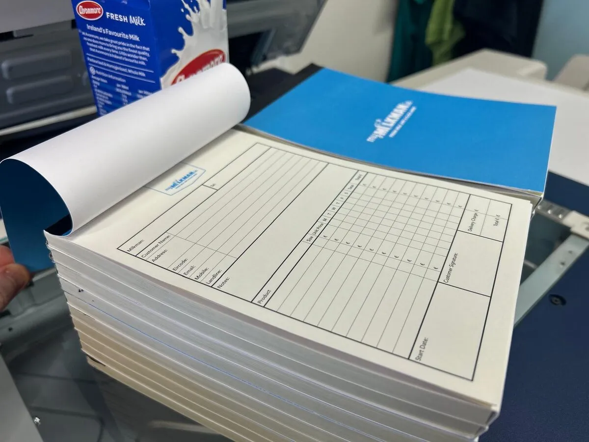 Open NCR docket book with printed numbered sheets - Print Ready