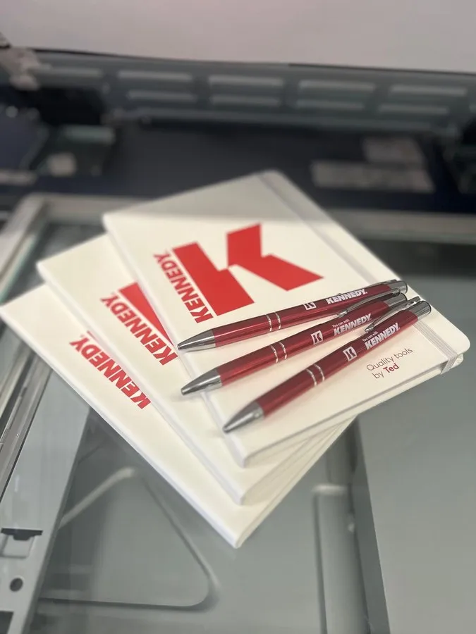 Printed notebooks and pens for Kennedy Tools