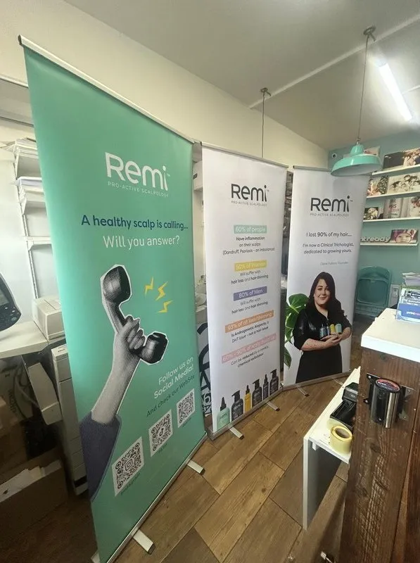 Three Remi pull up banners standing together