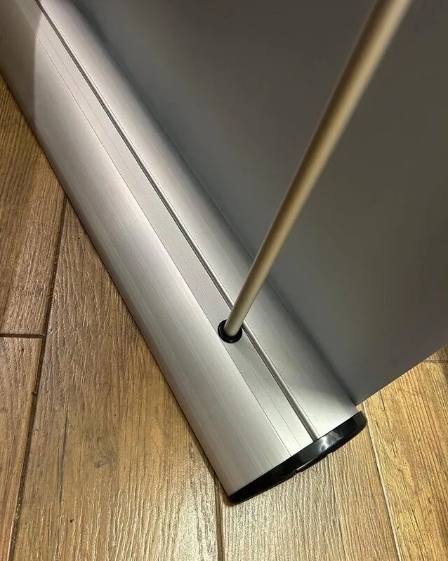 Pull up banner stand base and roller mechanism