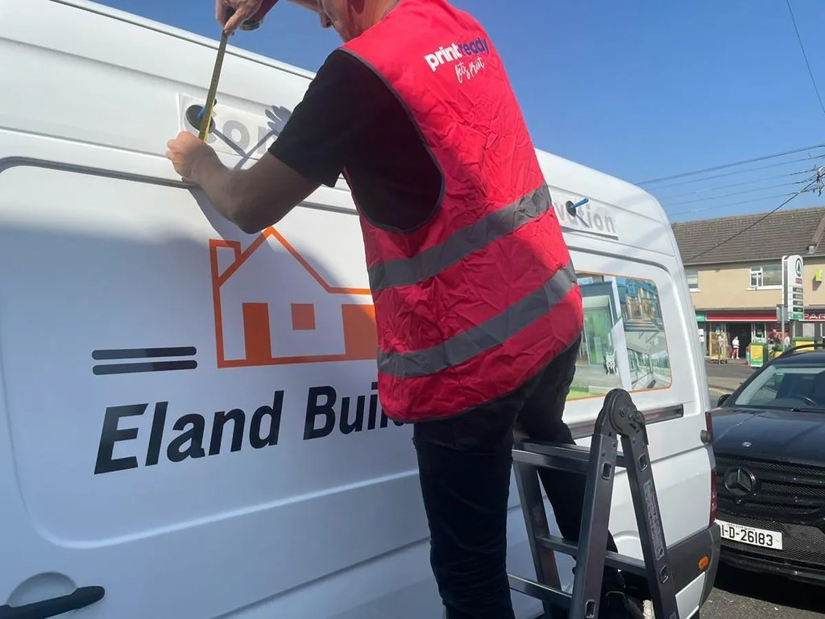 Eland Builders van lettering being fitted