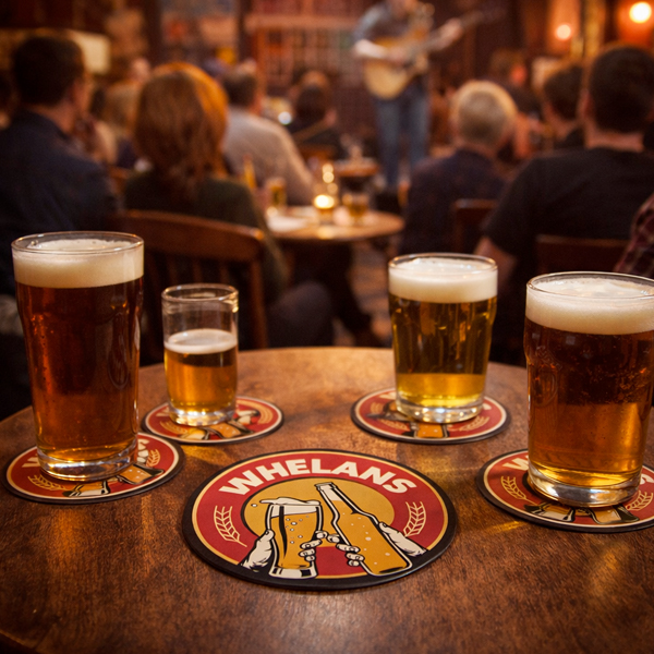 Round Whelan's beermat on a pub table with pints of beer